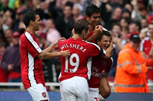 Andrey Arshavin celebrates scoring his and Arsenal s