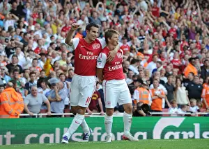 Andrey Arshavin celebrates scoring Arsenals goal with Robin van Persie