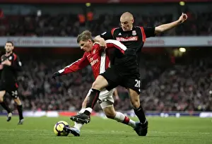 Andrey Arshavin holds off Andy Wilkinson (Stoke) on his way to scoring Arsenals 1st goal