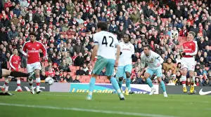 Andrey Arshavin shoots past Burnley goalkeeper Brian Jensen to score the srd Arsenal goal