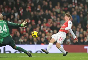 Arsenal V Everton 2010-11 Prints: Andrey Arshavin shoots past Everton goalkeeper Tim Howard to score the 1st Arsenal goal