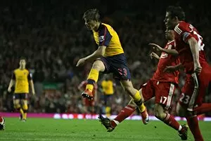 Liverpool v Arsenal 2008-9 Collection: Andrey Arshavin shoots past Liverpool goalkeeper Pepe