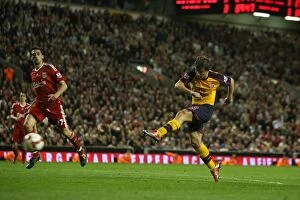 Liverpool v Arsenal 2008-9 Collection: Andrey Arshavin shoots past Liverpool goalkeeper Pepe