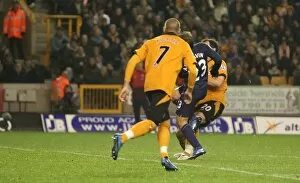Images Dated 7th November 2009: Andrey Arshavin shoots past Wolves goalkeeper Wayne