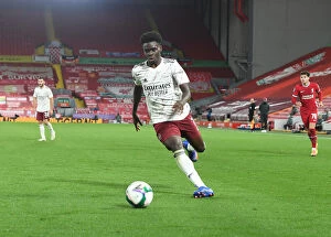 Images Dated 2nd October 2020: Empty Anfield: Bukayo Saka Leads Arsenal Against Liverpool in Carabao Cup Clash Amidst Pandemic