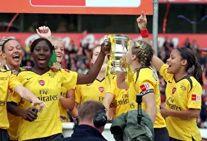 Anita Asante and Jayne Ludlow (Arsenal) lift the FA Cup Trophy