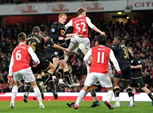 Images Dated 30th November 2010: Antolin Alcaraz (Wigan) scores an own goal for Arsenals 1st goal. Arsenal 2
