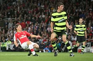Images Dated 26th August 2009: Ardrey Arshavin scores Arsenals 3rd goal past Massimo Donati