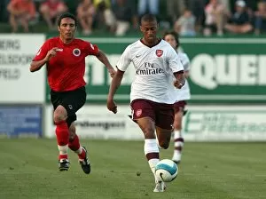 Images Dated 15th August 2007: Armand Traore (Arsenal) Oztuek (Genclerbirligi)