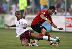 Images Dated 15th August 2007: Armand Traore (Arsenal) Sandro (Genclerbirligi)