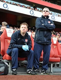 Images Dated 30th January 2011: Arsenal assistant manager Pat Rice and physio Colin Lewin. Arsenal 2: 1 Huddersfield Town
