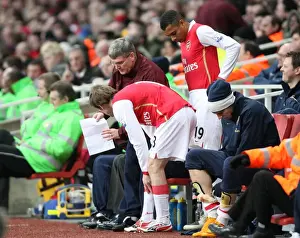 Arsenal assistant manager Pat Rice talks with substitutes Alex Hleb and Gilberto