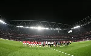 The Arsenal and AZ teams line up before the match