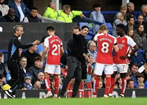 Everton v Arsenal 2023-24 Collection: Arsenal Boss Mikel Arteta Conferring with Saka and Odegaard during Everton Clash (2023-24)