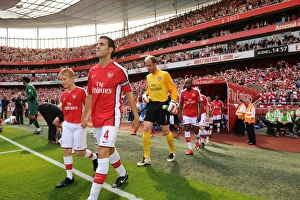 Arsenal captain Cesc Fabregas leads the team out