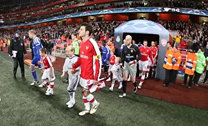 Arsenal captain Cesc Fabregas leads the team out for the first time