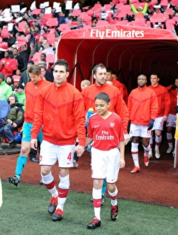Arsenal captain Cesc Fabregas leads the team out before the match. Arsenal 1 Arsenal captain Cesc Fabregas leads the team out before the match. Arsenal 1