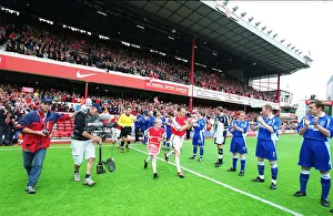 Arsenal captain Lee Dixon leads the team out onto the pitch for the match