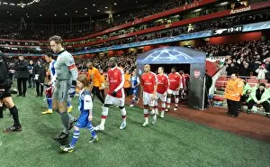 Arsenal v FC Porto 2009-10 Collection: Arsenal captain Manuel Almunia followed by Bacary Sagna and Gael Clichy leads out the team before