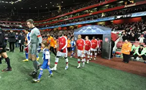 Arsenal V FC Porto 2009-10 Prints: Arsenal captain Manuel Almunia followed by Bacary Sagna and Gael Clichy leads out the team before the match