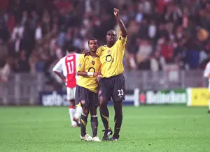 Arsenal captain Sol Campbell and Ashley Cole celebrate after the match