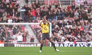 Arsenal captain Thierry Henry applauds the fans as he is substituted