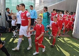Legia Warsaw v Arsenal 2010-11 Gallery: Arsenal captain Thomas Vermaelen leads out the team before the match. Legia Warsaw 5