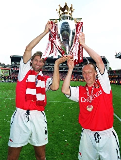 Arsenal captain Tony Adams and Lee Dixon lift the F. A