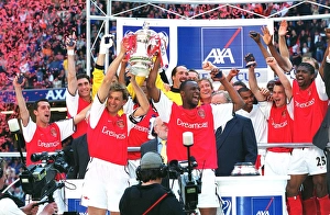 Images Dated 7th April 2005: Arsenal captain Tony Adams and vice-captain Patrick Vieira lift the FA Cup
