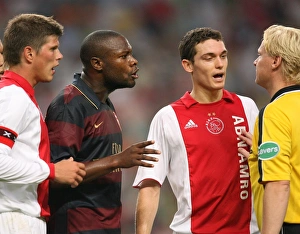 Arsenal captain William Gallas and Ajax defender Thomas Vermaelen talk to the referee Arsenal captain William Gallas and Ajax defender Thomas Vermaelen talk to the referee