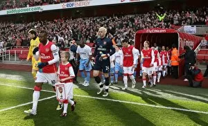Arsenal captain William Gallas leads out the team before the match
