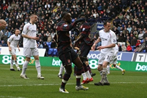 Images Dated 31st March 2008: Arsenal captain William Gallas shoots past Bolton goalkeeper Ali Al Hasbi to score the 1st goal