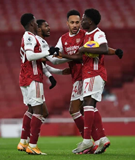 Images Dated 16th December 2020: Arsenal Celebrate: Aubameyang, Nketiah, Saka Score against Southampton (2020-21)