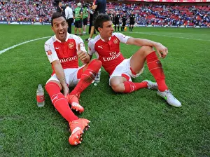 Arsenal Celebrate Community Shield Victory over Chelsea (2015): Santi Cazorla and Laurent Koscielny Rejoice
