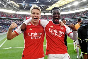 Arsenal Celebrate Community Shield Victory over Manchester City (2023-24): Martin Odegaard and Edward Nketiah Rejoice in Glory