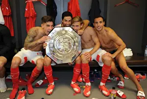 Arsenal Celebrate FA Community Shield Victory over Chelsea (2015-16): Hector Bellerin, Mikel Arteta, Nacho Monreal, and Santi Cazorla Rejoice