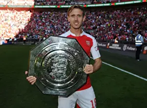 Arsenal Celebrate FA Community Shield Victory over Chelsea (2015-16): Nacho Monreal Raises the Trophy