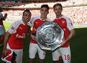Arsenal Celebrate FA Community Shield Victory over Chelsea (2015): Santi Cazorla, Hector Bellerin, and Nacho Monreal Rejoice