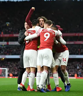 Arsenal Celebrate Third Goal Against Tottenham in Premier League Clash