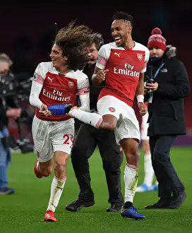 Arsenal Celebrate: Guendouzi and Aubameyang Rejoice in Arsenal's Victory over Tottenham