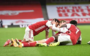 Arsenal Celebrate Martin Odegaard's Goal Against Tottenham in Empty Emirates Stadium