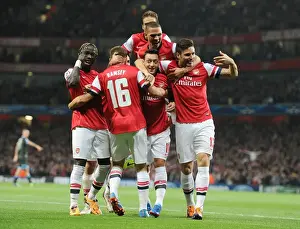 Arsenal V Napoli 2013-14 Prints: Arsenal Celebrate Ozil's Goal Against Napoli in 2013-14 Champions League