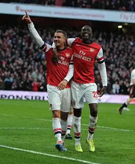 Arsenal V Liverpool - FA Cup 2013-14 Prints: Arsenal Celebrate: Podolski and Sanogo Score in FA Cup Fifth Round Against Liverpool