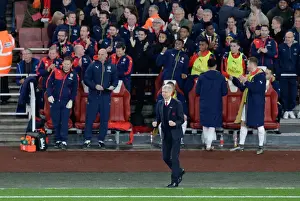 Arsenal Celebrates First Goal Against Manchester City (2015-16): Arsene Wenger and Team Rejoice on the Emirates Stadium Bench