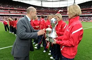 Arsenal CEO Ivan Gazidis hand the trophy to Faye White of the Arsenal Ladies