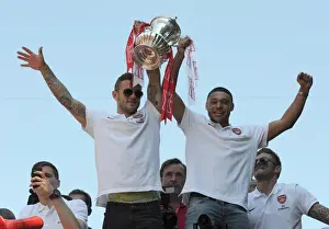 Arsenal Trophy Parade 2014 Prints: Arsenal Champions: Jack Wilshere and Alex Oxlade-Chamberlain Celebrate Victory on the Trophy Parade