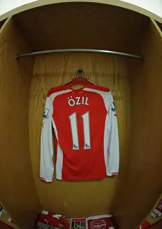 Arsenal V Stoke City 2014-15 Prints: Arsenal Changing Room: Mesut Ozil's Shirt Before Arsenal vs Stoke City (2014-15)