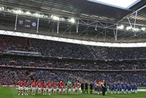 The Arsenal and Chelsea teams line up before the match