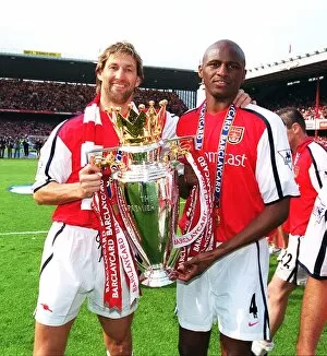 Arsenal cpatain Tony Adams and vice-captain Patrick Vieira lift the F.A