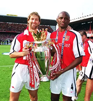 Arsenal cpatain Tony Adams and vice-captain Patrick Vieira lift the F. A
